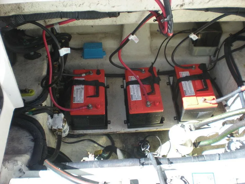 Slide: The Image of Three red batteries in a 2006 Seaswirl Striper boat's engine compartment. - 29