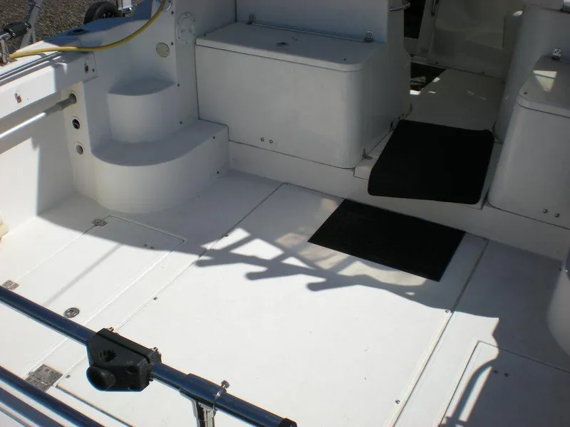 Slide: The Image of 2006 Seaswirl Striper boat interior with white deck and seating area. - 3