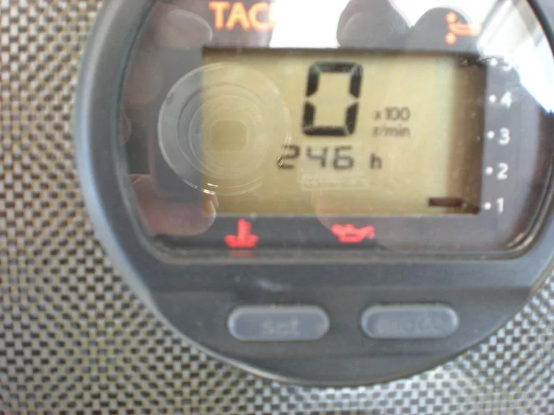Slide: The Image of Close-up of a 2006 Seaswirl Striper tachometer displaying 246 hours. - 36