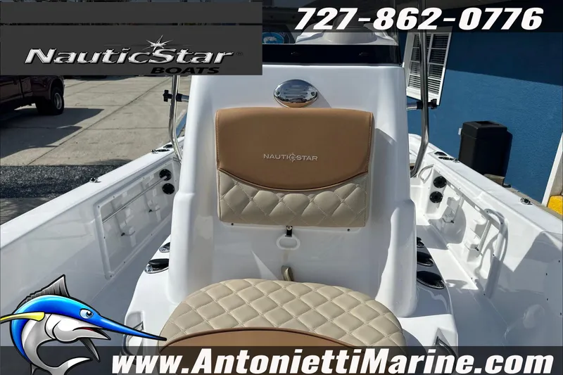 Slide: The Image of 2025 NauticStar 194 Bay boat interior with tan seating, showcased by Antonietti Marine. - 11