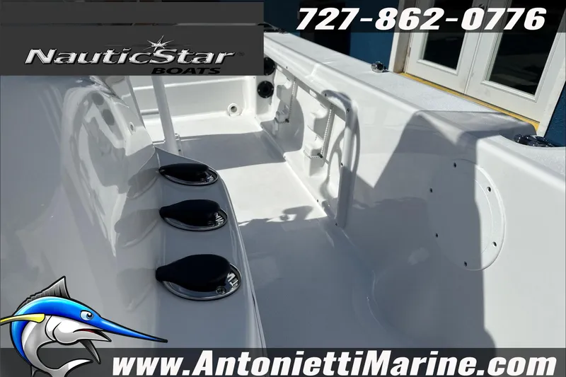 Slide: The Image of 2025 NauticStar 194 Bay boat interior with contact details and logo. - 13