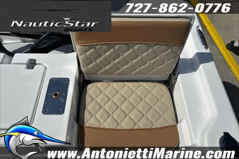 Slide: The Image of 2025 NauticStar 194 Bay boat seat with quilted design, featuring contact details and logo. - 18