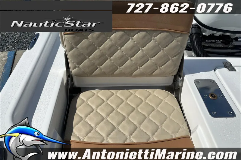 Slide: The Image of 2025 NauticStar 194 Bay boat seat with quilted design, featuring contact details and logo. - 21