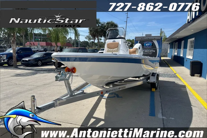 Slide: The Image of 2025 NauticStar 194 Bay boat on trailer at Antonietti Marine dealership. - 4