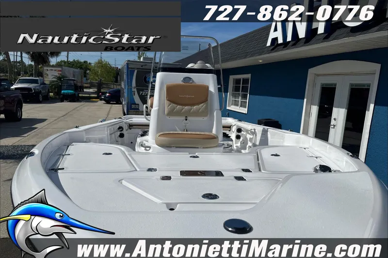 Slide: The Image of 2025 NauticStar 194 Bay boat displayed at Antonietti Marine dealership. - 5