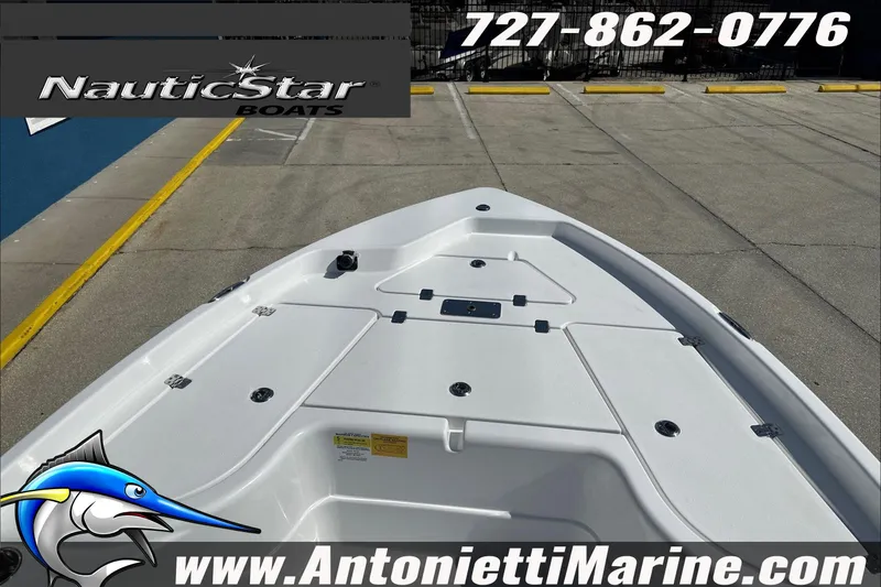 Slide: The Image of 2025 NauticStar 194 Bay boat deck at Antonietti Marine dealership. - 6