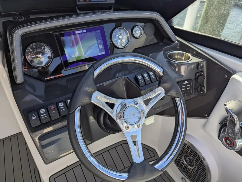 Slide: The Image of Cockpit of 2023 Monterey M-65 boat with steering wheel and control panel. - 32
