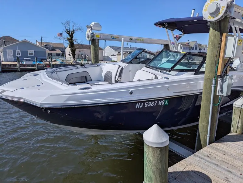 Slide: The Image of 2023 Monterey M-65 boat docked at a marina, featuring sleek design and modern amenities. - 4