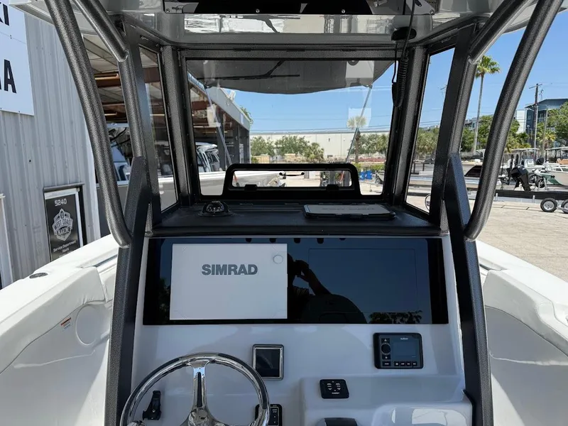 Slide: The Image of 2025 Sea Pro 262 Offshore boat dashboard with Simrad navigation system. - 13