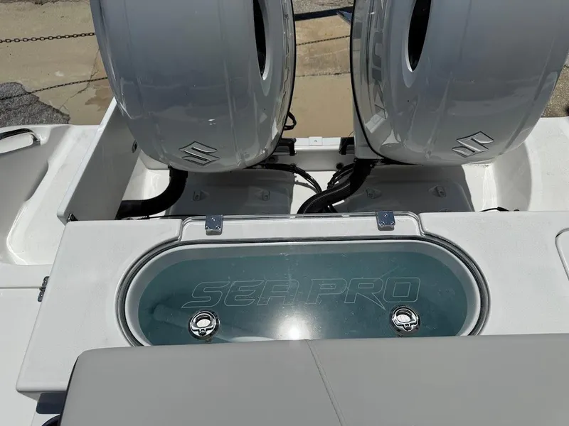 Slide: The Image of 2025 Sea Pro 262 Offshore boat with dual engines and branded livewell. - 15