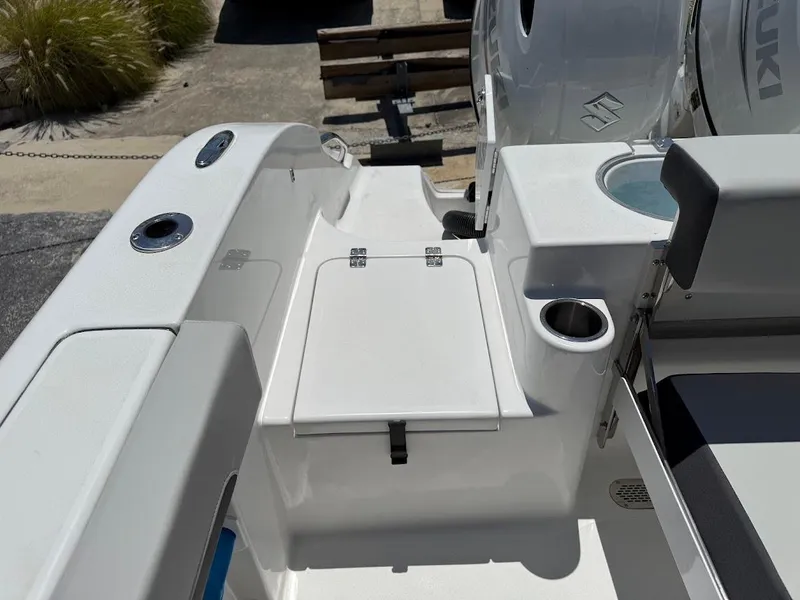 Slide: The Image of 2025 Sea Pro 262 Offshore boat deck with storage and cup holder. - 16
