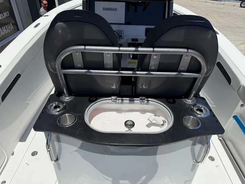 Slide: The Image of 2025 Sea Pro 262 Offshore boat with a Simrad console and fishing station. - 17