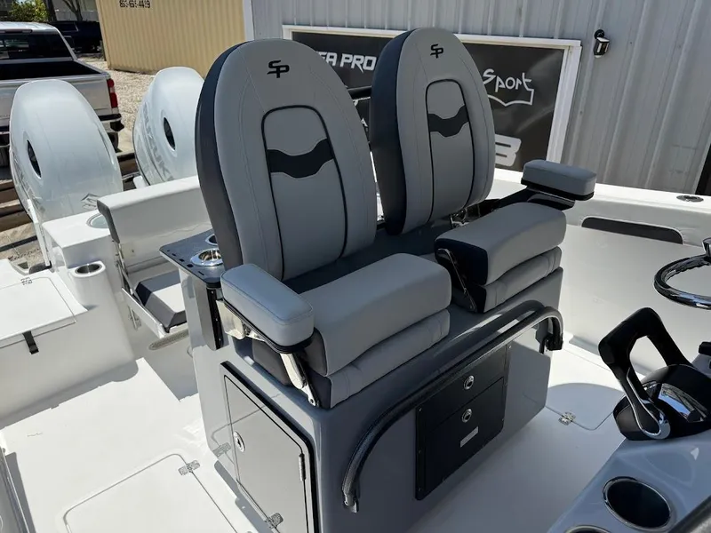 Slide: The Image of 2025 Sea Pro 262 Offshore boat seats, featuring sleek gray design and armrests. - 18
