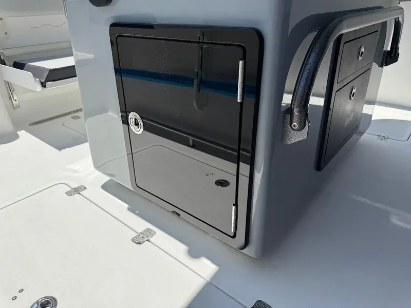Slide: The Image of 2025 Sea Pro 262 Offshore boat storage compartment and seating area. - 19
