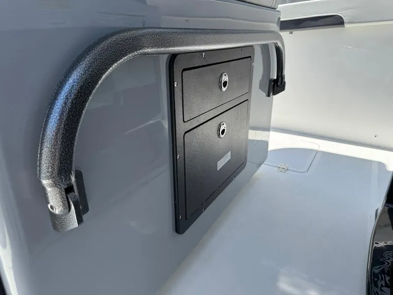 Slide: The Image of 2025 Sea Pro 262 Offshore boat storage compartment with handle. - 20