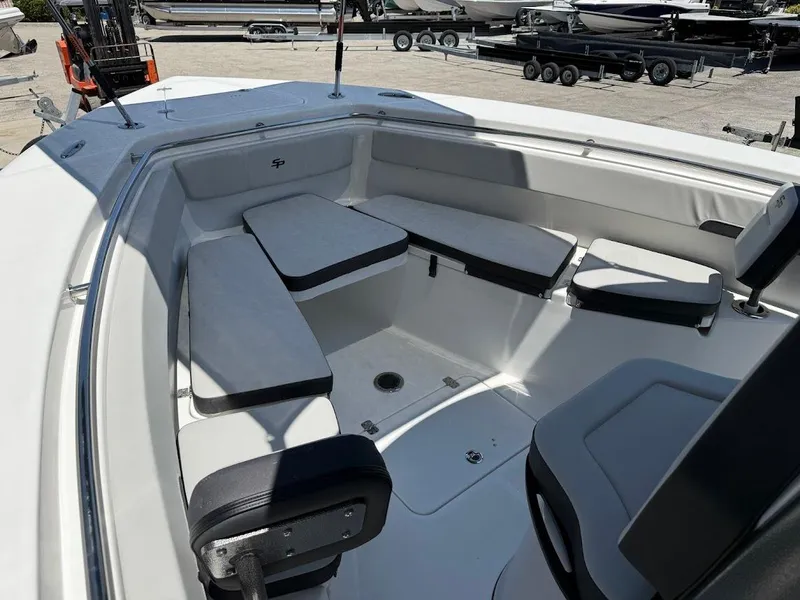 Slide: The Image of 2025 Sea Pro 262 Offshore boat interior with cushioned seating and spacious layout. - 22