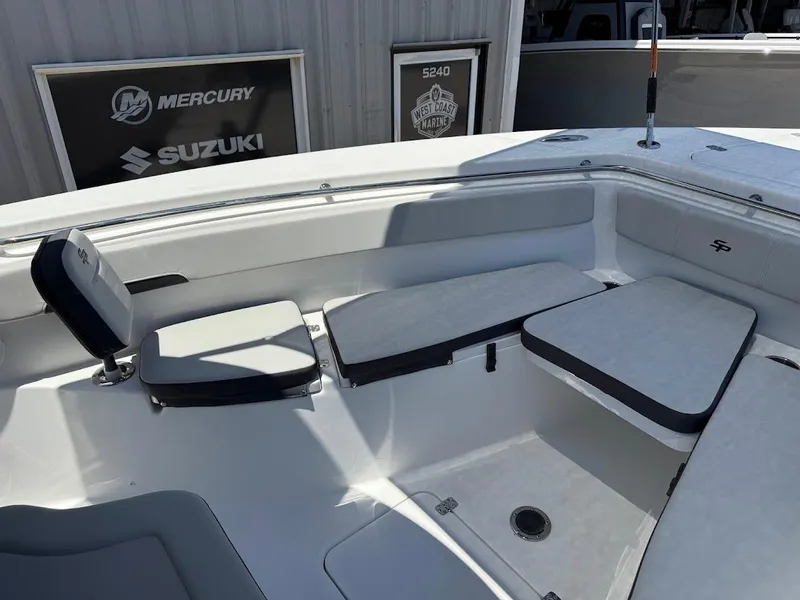 Slide: The Image of 2025 Sea Pro 262 Offshore boat interior with cushioned seating and storage. - 24