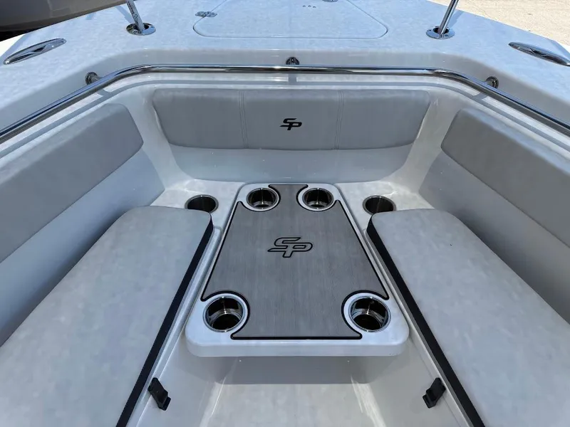 Slide: The Image of 2025 Sea Pro 262 Offshore boat interior with cushioned seating and table. - 25
