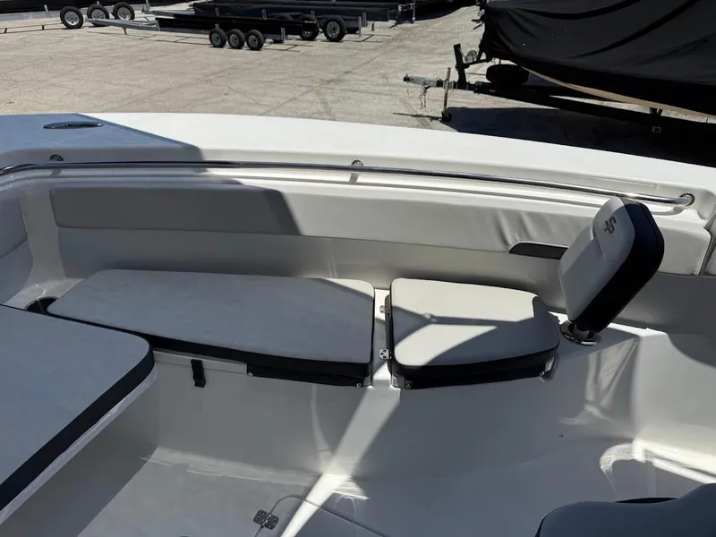 Slide: The Image of 2025 Sea Pro 262 Offshore boat interior with cushioned seating and sleek design. - 26