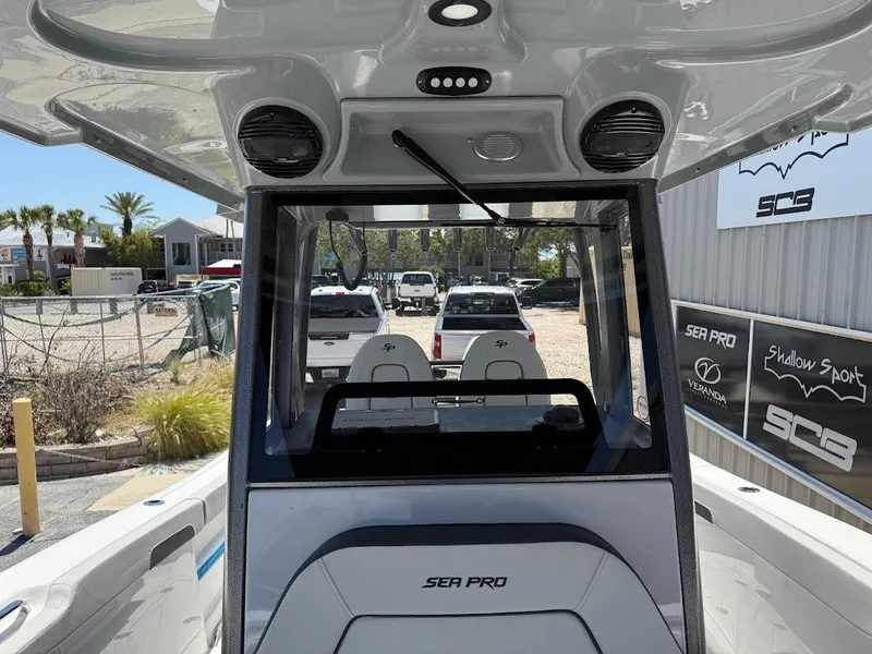 Slide: The Image of 2025 Sea Pro 262 Offshore boat interior with modern console and seating. - 28