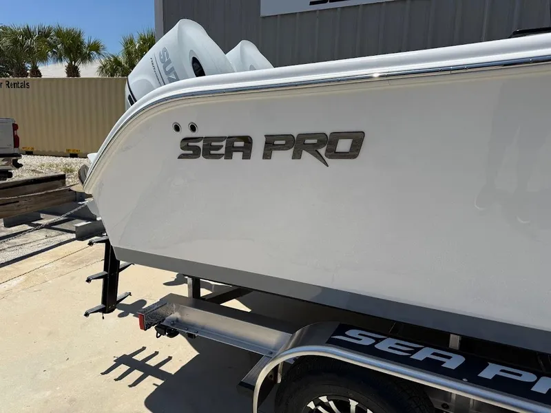 Slide: The Image of 2025 Sea Pro 262 Offshore boat on trailer, side view with logo visible. - 5