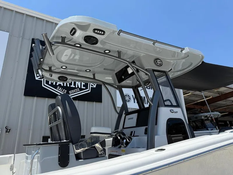 Slide: The Image of 2025 Sea Pro 262 Offshore boat with T-top, docked at a marine sales service. - 6