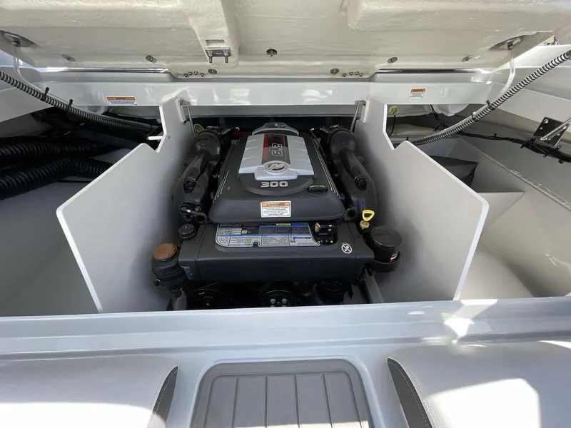 Slide: The Image of 2023 Crownline 240 SS engine compartment showcasing powerful marine engine. - 9