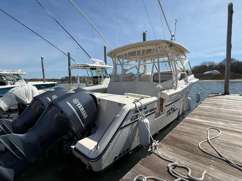 Slide: The Image of 2015 Grady-White Freedom 335 boat docked with Yamaha engines. - 4