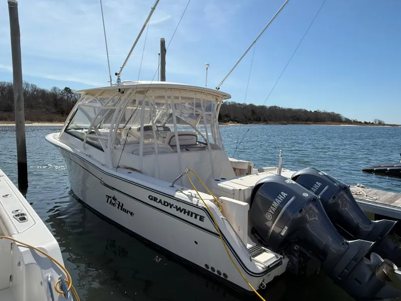 Slide: The Image of 2015 Grady-White Freedom 335 boat docked with twin Yamaha engines. - 6