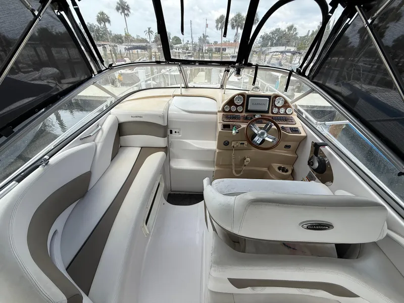 Slide: The Image of 2014 Glastron GS 289 boat interior with helm, seating, and dashboard. - 17
