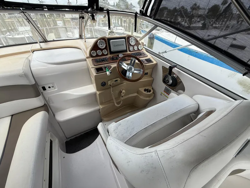 Slide: The Image of 2014 Glastron GS 289 boat cockpit with steering wheel and control panel. - 20