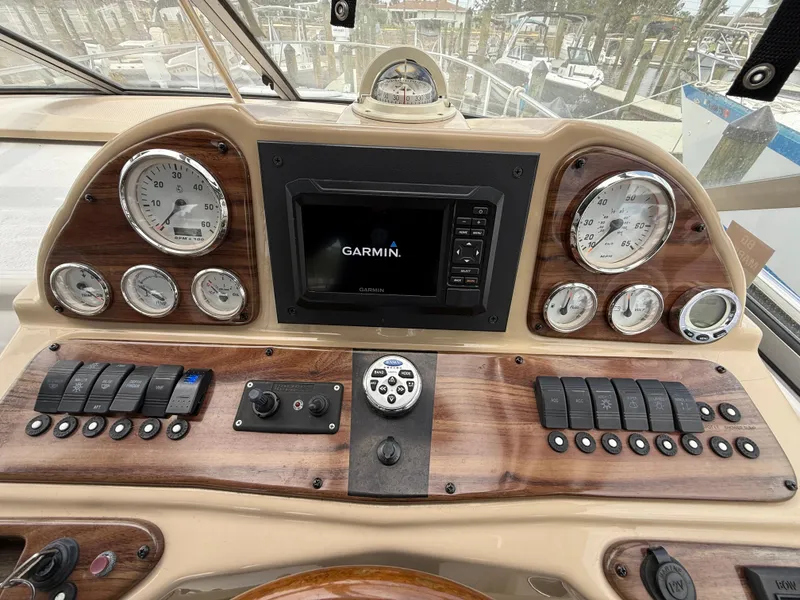 Slide: The Image of 2014 Glastron GS 289 dashboard with Garmin navigation system and gauges. - 24