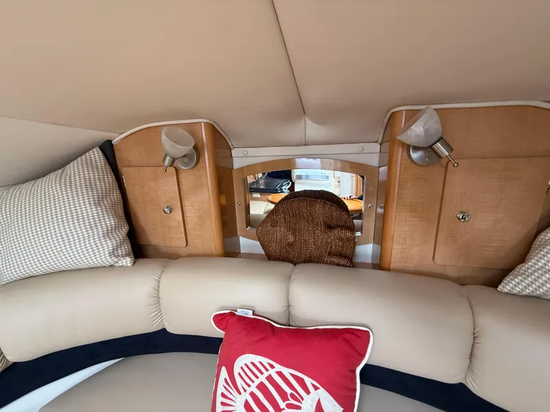 Slide: The Image of Interior of 2014 Glastron GS 289 boat with cozy seating and decorative pillows. - 34