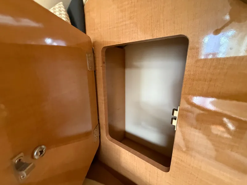 Slide: The Image of Open wooden cabinet on 2014 Glastron GS 289 boat interior. - 37