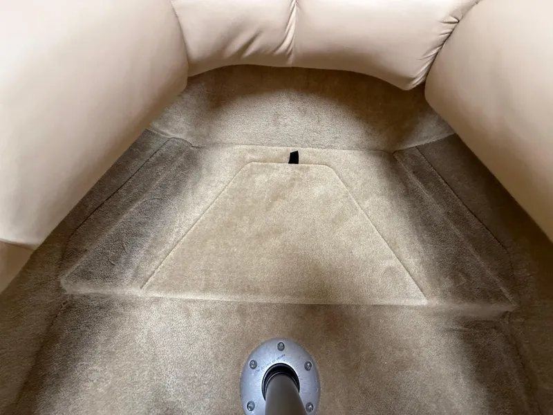 Slide: The Image of 2014 Glastron GS 289 boat interior with beige upholstery and carpeted flooring. - 42