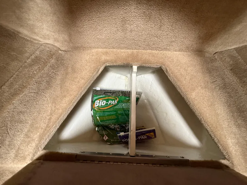 Slide: The Image of 2014 Glastron GS 289 interior storage with Bio-Pak cleaning products. - 43