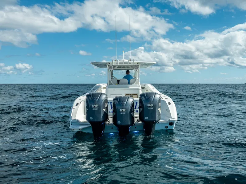 Slide: The Image of 2018 Yellowfin 42 boat with triple V8 engines on open ocean. - 18