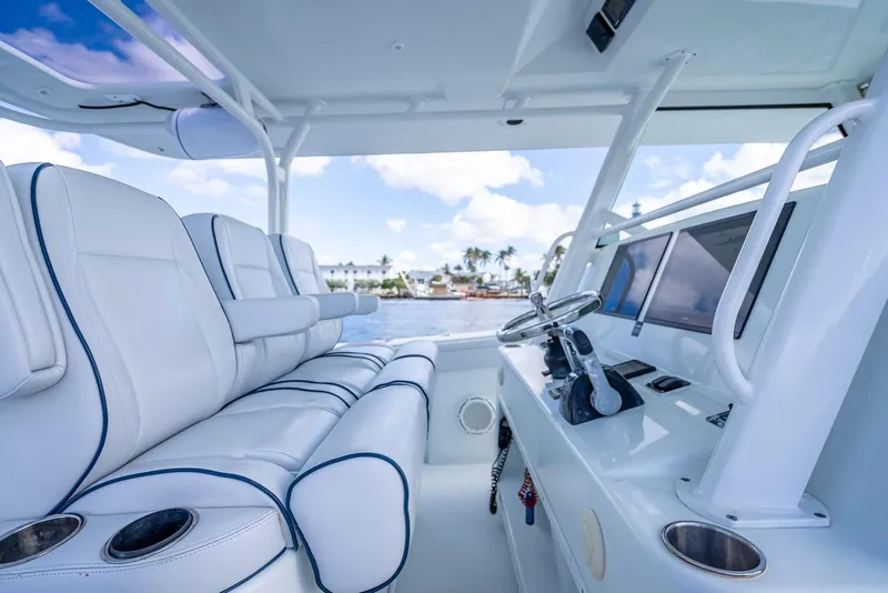 Slide: The Image of Interior of 2018 Yellowfin 42 boat with white seating and modern controls. - 25