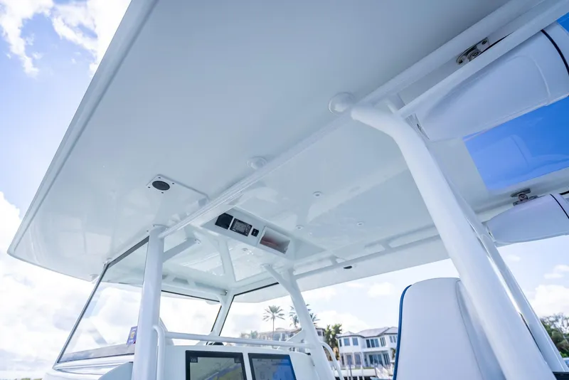 Slide: The Image of 2018 Yellowfin 42 boat with sleek white canopy and modern navigation equipment. - 28