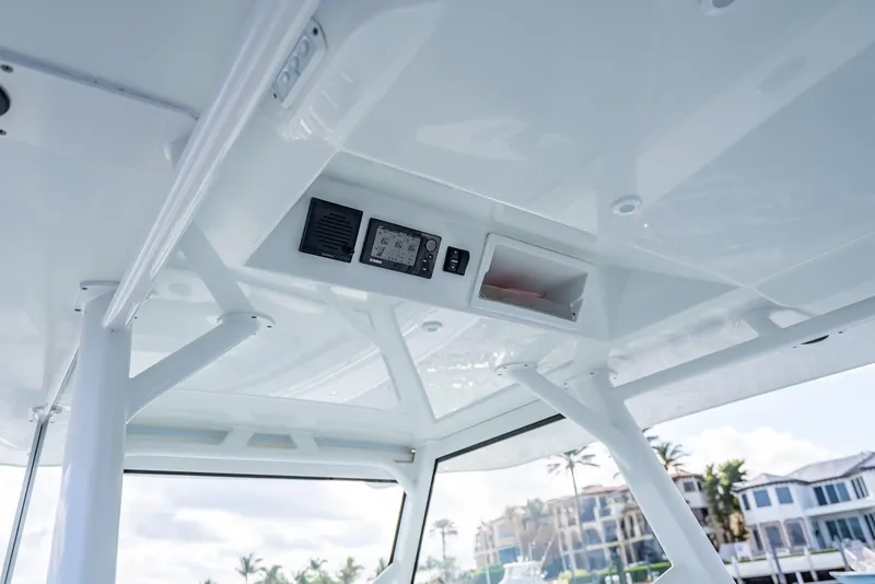 Slide: The Image of 2018 Yellowfin 42 boat interior with control panel and overhead storage. - 30