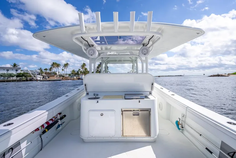 Slide: The Image of 2018 Yellowfin 42 boat with spacious deck, clear skies, and ocean view. - 34