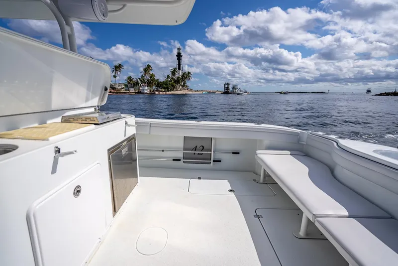 Slide: The Image of 2018 Yellowfin 42 boat interior with ocean view and distant lighthouse. - 36