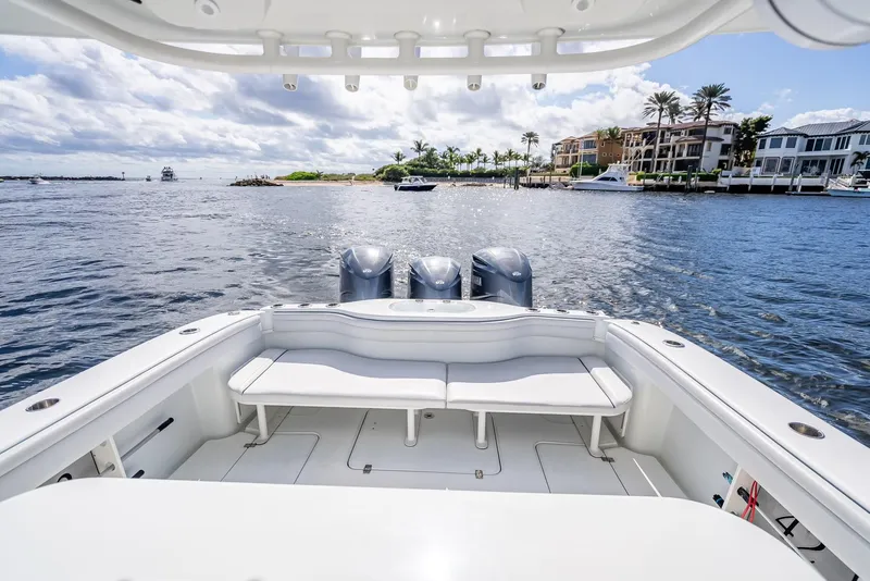 Slide: The Image of 2018 Yellowfin 42 boat with triple engines, spacious deck, and waterfront view. - 39