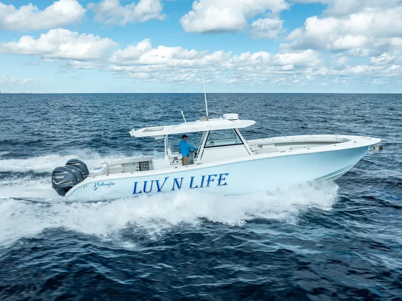 Slide: The Image of 2018 Yellowfin 42 boat cruising on open ocean with "LUV N LIFE" on the side. - 4