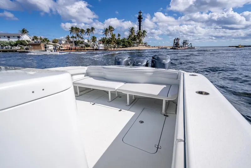 Slide: The Image of 2018 Yellowfin 42 boat on water, scenic view of lighthouse and palm trees. - 40