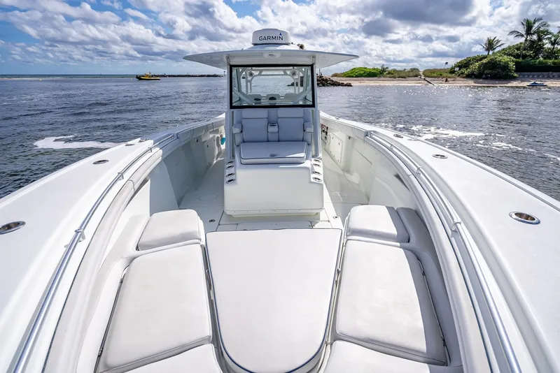 Slide: The Image of 2018 Yellowfin 42 boat on water, featuring spacious deck and modern design. - 45