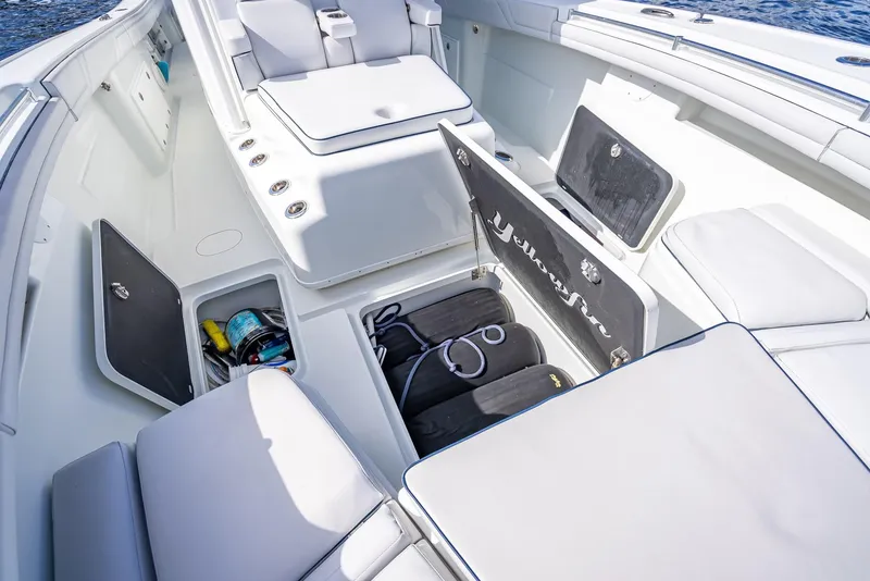Slide: The Image of 2018 Yellowfin 42 boat interior with open storage compartments and seating. - 47