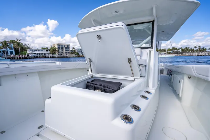 Slide: The Image of 2018 Yellowfin 42 boat with open storage compartment, ocean view, and modern design. - 49