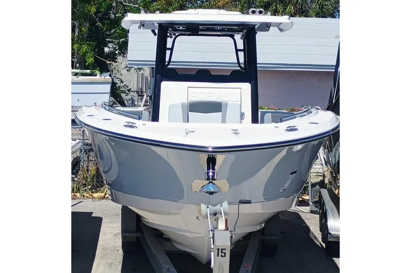 Slide: The Image of 2025 Robalo 300 boat on trailer, front view, in outdoor setting. - 4