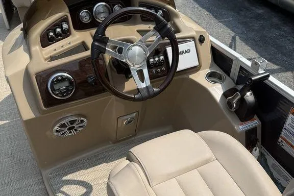 Slide: The Image of 2018 Bennington 23GSRFB boat dashboard with steering wheel and control panel. - 5